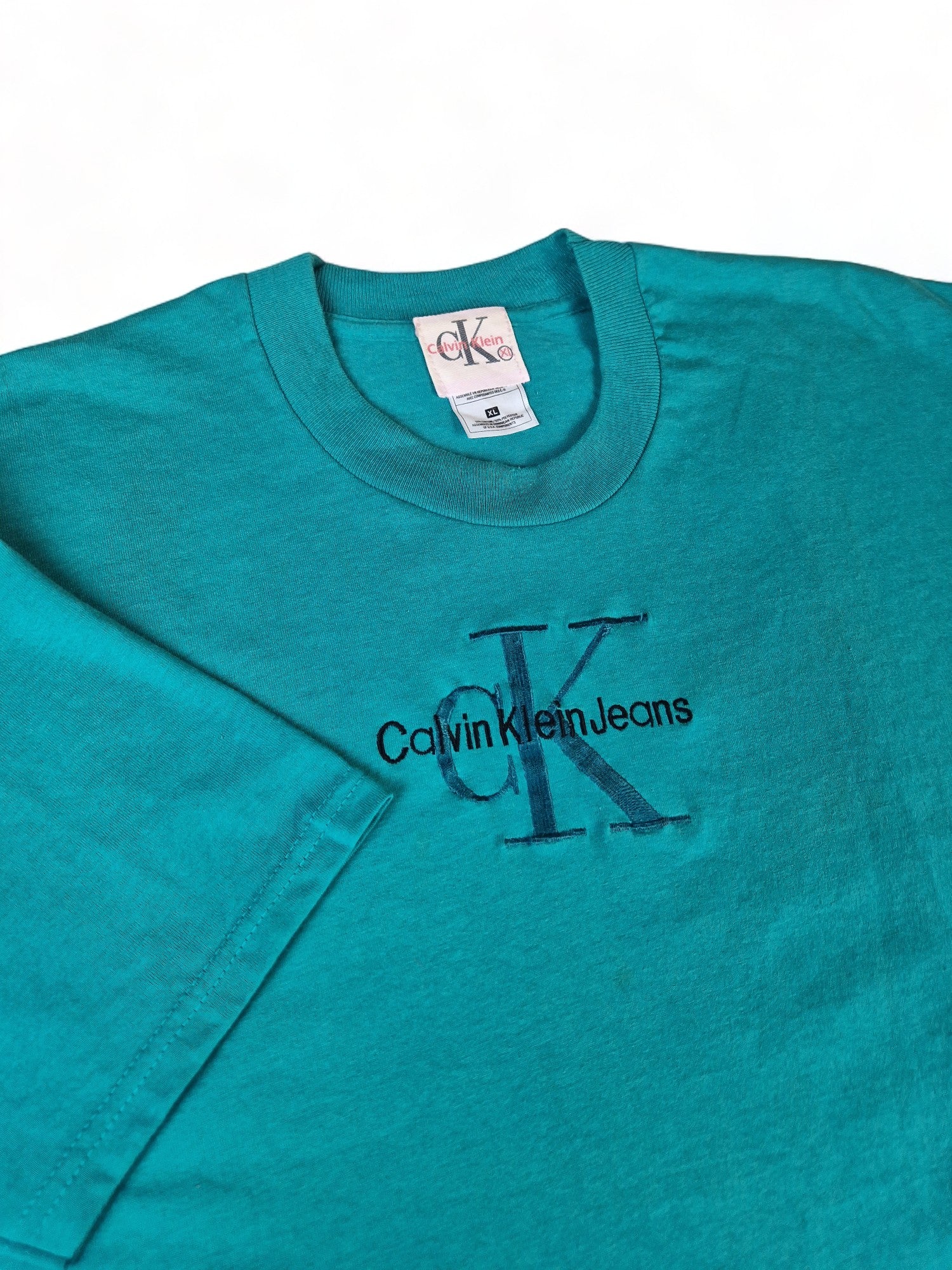 Vintage Calvin Klein Bootleg Shirt Auf Fruit Of The Loom Blank Türkis XL - RareRags